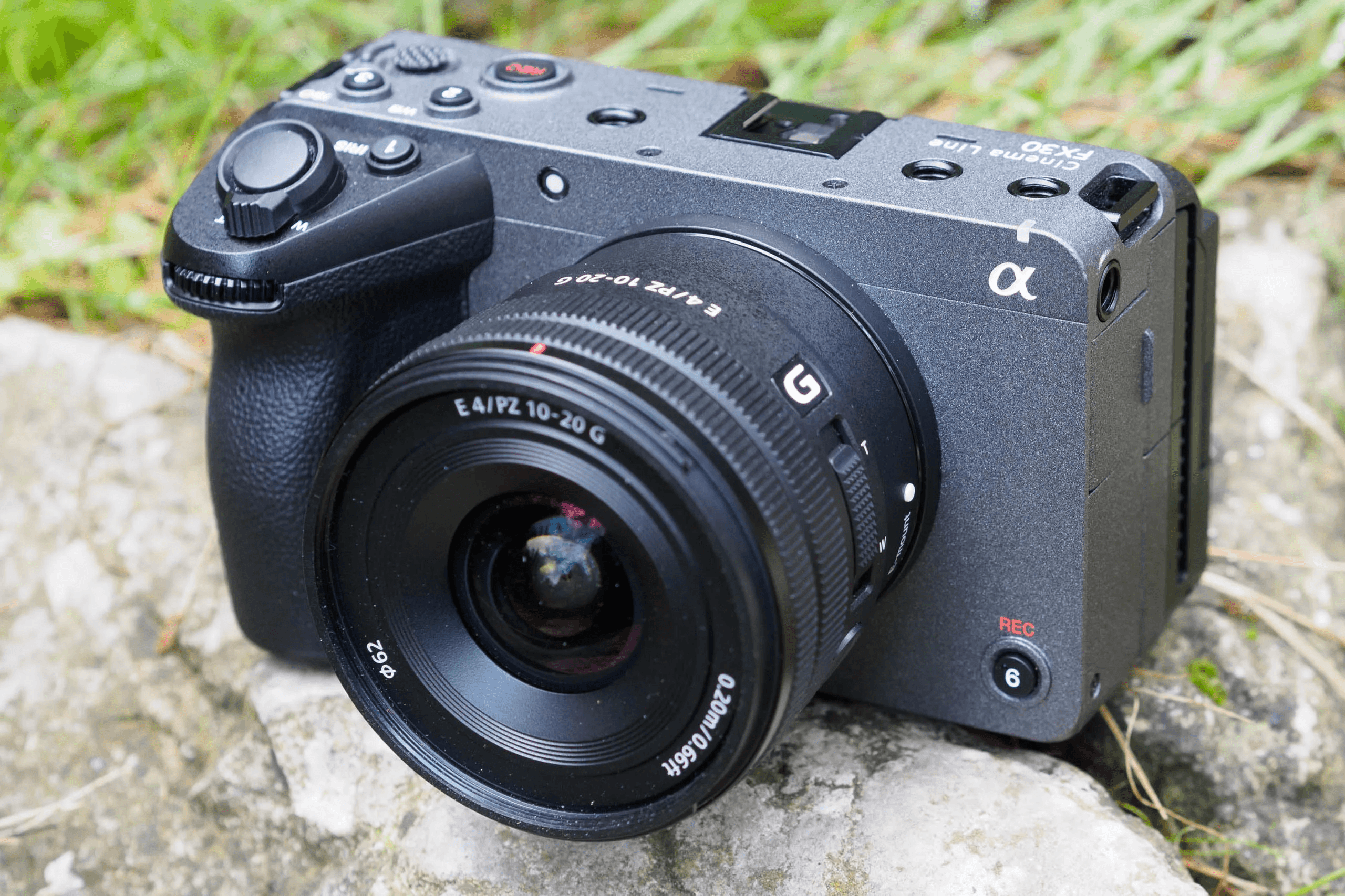 A picture of a Sony FX30 Camera sitting on a rock.